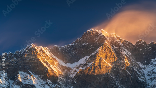 golfer light and wind on peak Lhotse in Nepal in panoramic view photo