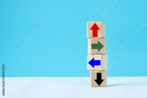  wooden cubes with different arrows. photo