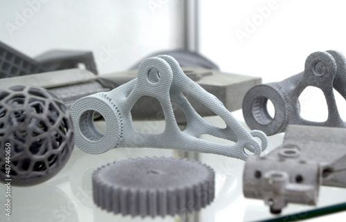Different objects printed on industrial powder 3D printer. Multi Jet Fusion MJF 3D printing. Object printed on powder 3D printer from powder polyamide close-up. New modern additive technology
