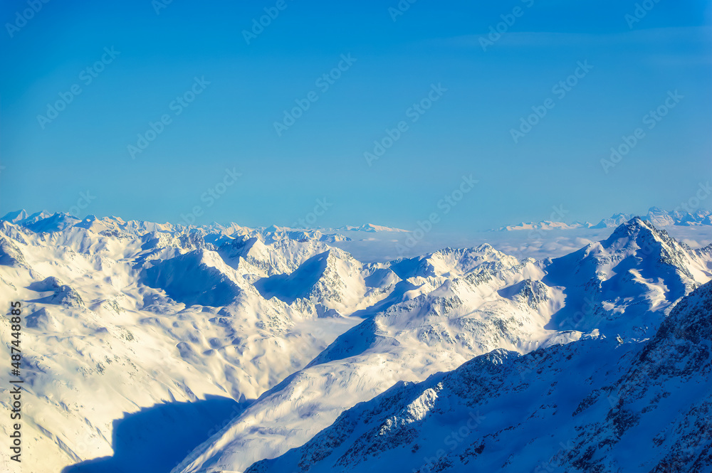 Naklejka premium Austrian Alps covered with snow during sunny winter day.