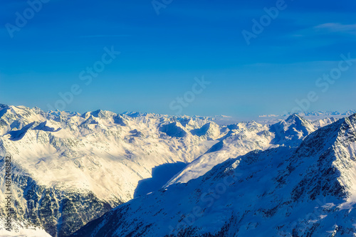 Austrian Alps covered with snow during sunny winter day.