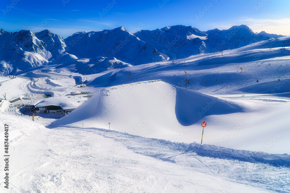  Skiers at glacier ski region established at altitude above 3000 meters over the sea in Soelden, Austria. - obrazy, fototapety, plakaty 