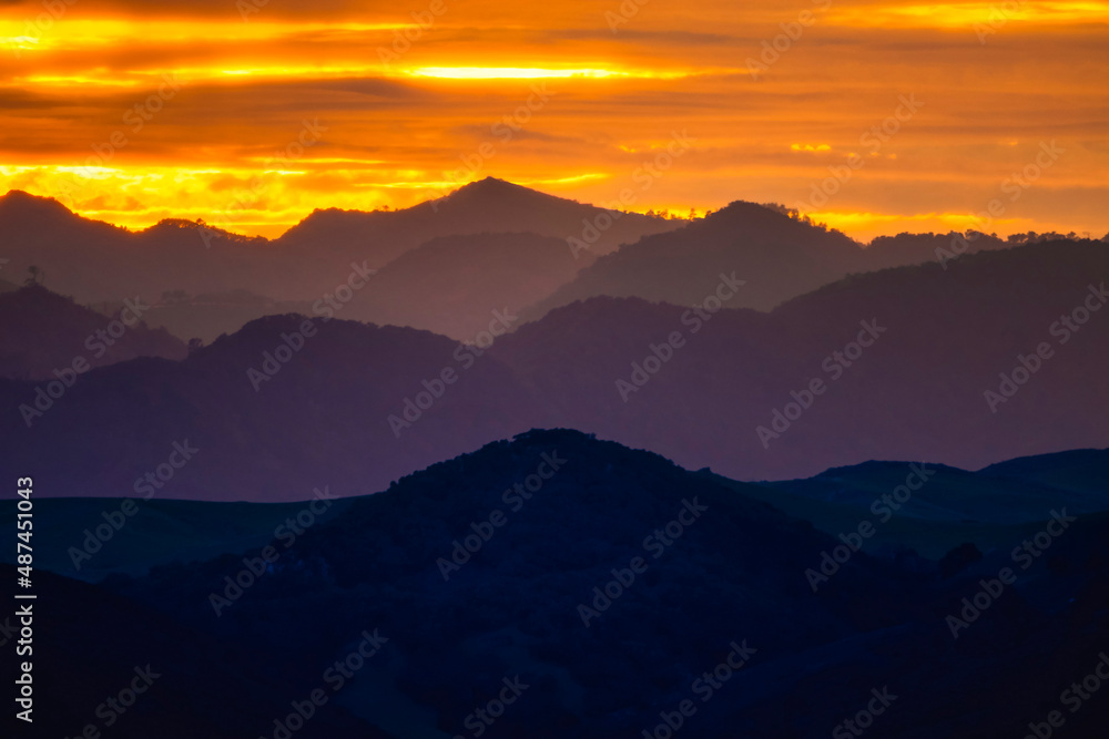 Sunrise in the Layers of Mountains, silhouette