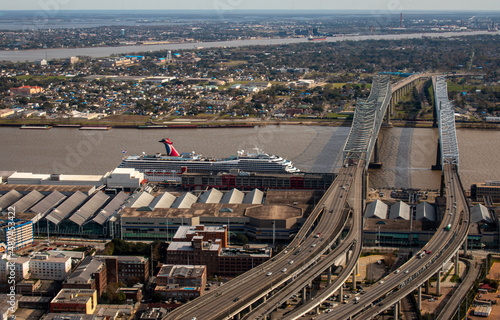 A helicopter view of New Orleans from the downtown in the direction of Crescent City Connection Bridge and a cruise terminal, Louisiana, USA. January the 10th 2022