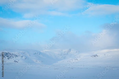 Mountains along Kungsleden trail in winter between Alesjaure and Tjaktja huts, sunrise in Swedish Lapland, April 2021