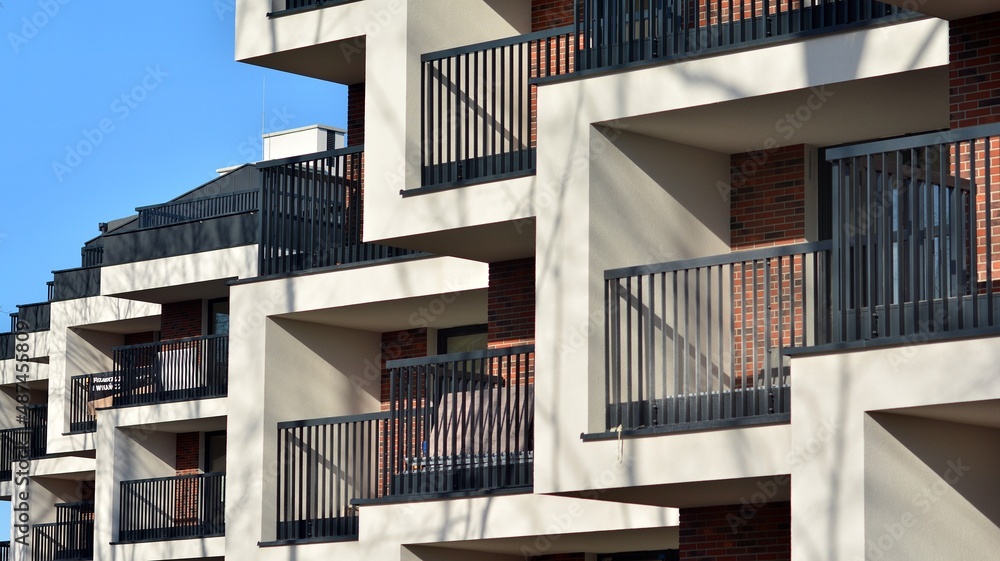Abstract architecture, fragment of modern urban geometry,. Modern apartment building on a sunny day with a blue sky,. European residential apartment buildings. Abstract architecture, fragment of modern urban geometry,. Modern apartment building on a sunny day with a blue sky,. European residential apartment buildings.