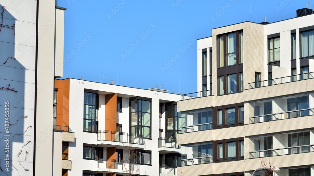 Abstract architecture, fragment of modern urban geometry,. Modern apartment building on a sunny day with a blue sky,. European residential apartment buildings.