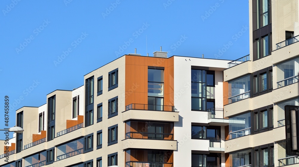 Abstract architecture, fragment of modern urban geometry,. Modern apartment building on a sunny day with a blue sky,. European residential apartment buildings.