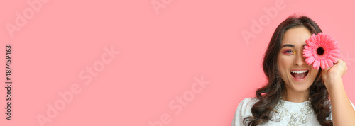 Happy woman with gerbera fl...