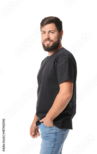 Handsome man in black t-shirt on white background © Pixel-Shot