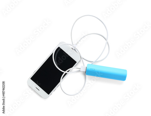 White smartphone charging w...