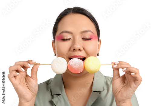 Beautiful Asian woman eatin...