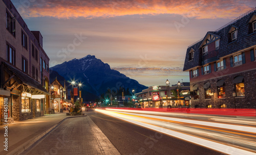 Golden Sunset On Banff Avenue in the National Park With Light Trails From Traffic Illuminating the Streets.