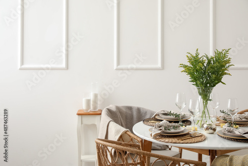 Valokuvatapetti Stylish table setting near white wall