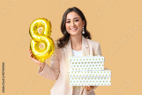 Happy woman with balloon an...