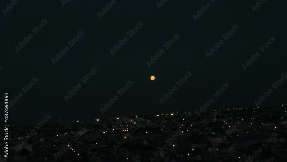 City ​​under the night of the full moon Fly Drone 4k aerial <> Argentina Buenos Aires La Matanza
