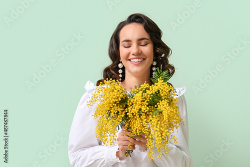 Beautiful young woman with ...