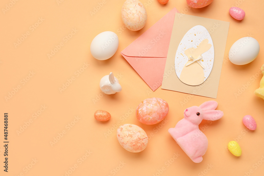 Beautiful Easter composition with greeting card, painted eggs and bunny on color background Beautiful Easter composition with greeting card, painted eggs and bunny on color background