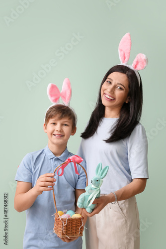 Little boy, his mother with...