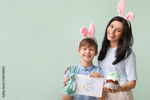 Little boy, his mother with...