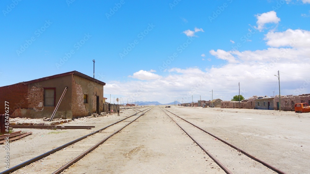 Train roadway with blue sky and desert