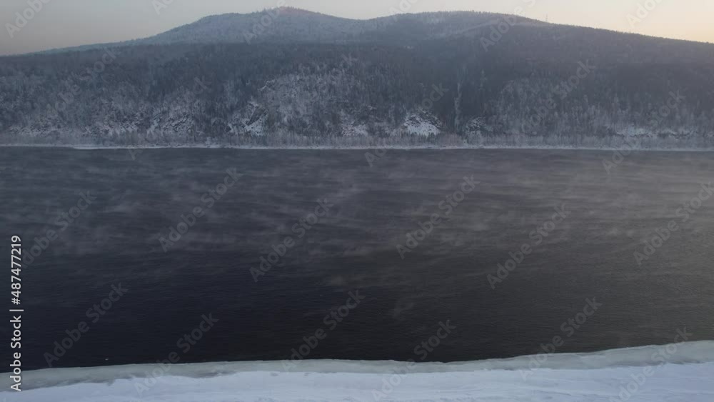 Winter landscape on the river in Siberia, aerial shot Winter landscape on the river in Siberia, aerial shot