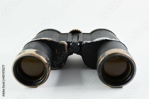 old binoculars on a white background.