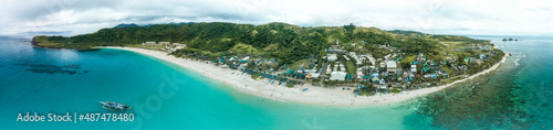 Panorama aerial of Blue Lagoon, Pagudpud, Ilocos Norte during an overcast day. Pristine beach and waters. photo