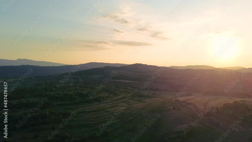 Beautiful summer scene of sunset behind the mountains. Landscape and nature aerial view Beautiful summer scene of sunset behind the mountains. Landscape and nature aerial view