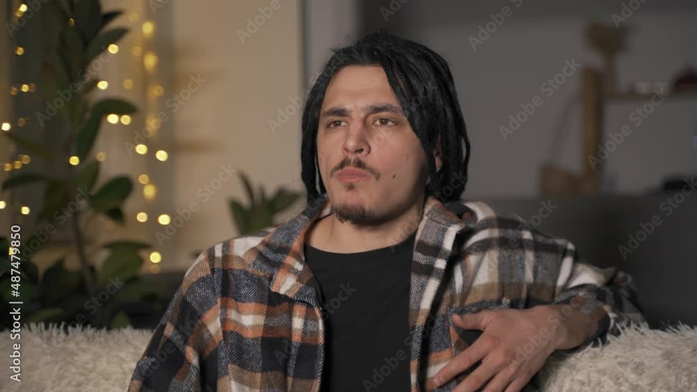 Close-up of the face of a man who is very passionate about watching a movie Close-up of the face of a man who is very passionate about watching a movie