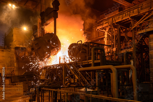 Valokuvatapetti Pouring molten metal into a metallurgical electric arc furnace