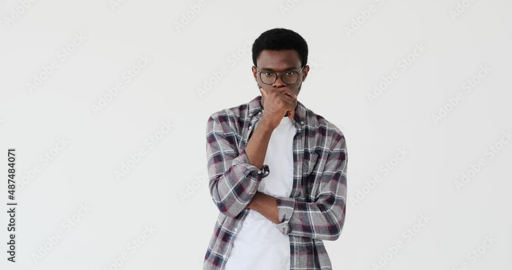 Thoughtful man saying no by waving his finger over white background Thoughtful man saying no by waving his finger over white background