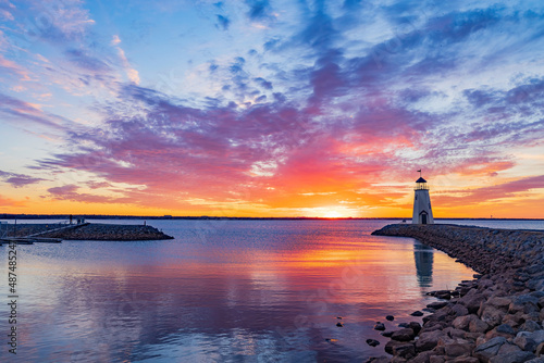 Sunset beautiful afterglow over the lighthouse of Lake Hefner photo