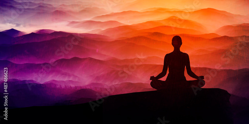 Silhouette of a women in the lotus position and space, meditation, yoga background