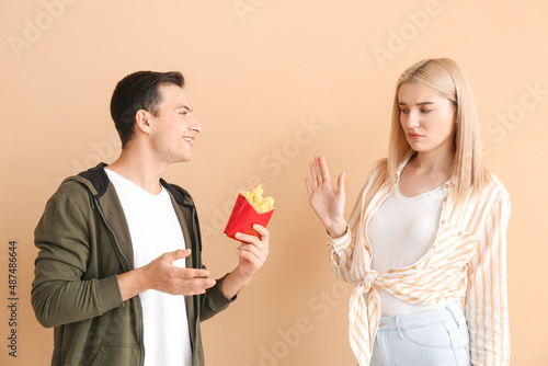 Young woman refusing to eat...