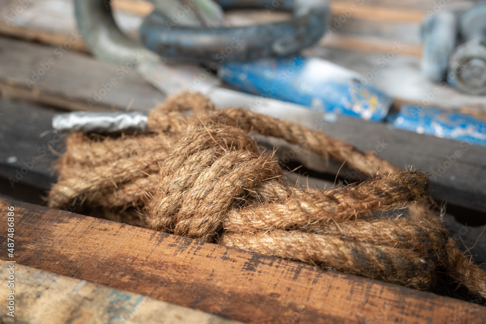 A knot of rope which is using in the industrial. Working tool equipment object photo. Close-up and selective focus. A knot of rope which is using in the industrial. Working tool equipment object photo. Close-up and selective focus.