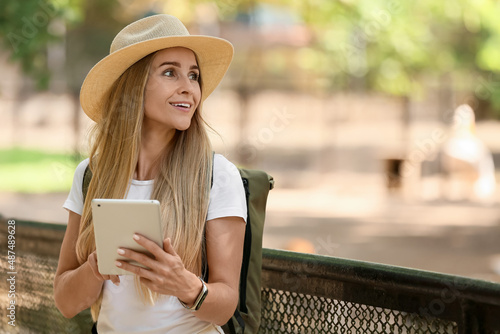 Female tourist with tablet ...
