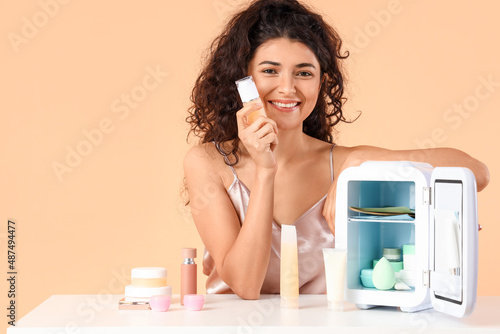 Young woman near table with...