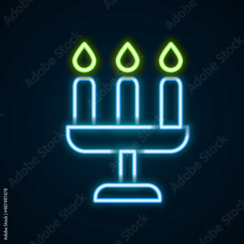 Glowing neon line Candelabrum with three candlesticks icon isolated on black background. Colorful outline concept. Vector