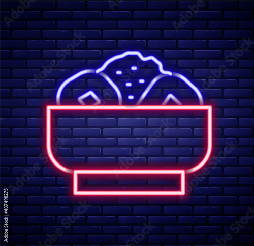Glowing neon line Chow mein on plate icon isolated on brick wall background. Asian food. Colorful outline concept. Vector