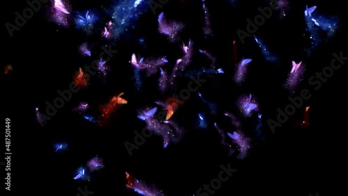 Magical butterflies of different colors fly, leaving behind a trail of sparkles. An amazing phenomenon of nature. The space is filled with amazingly beautiful butterflies of all shades.