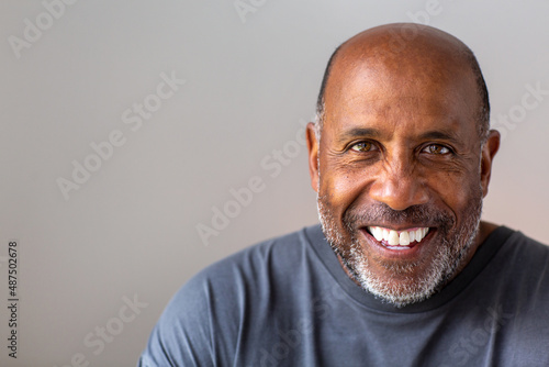 Portrait of a mature man smiling looking the camera.