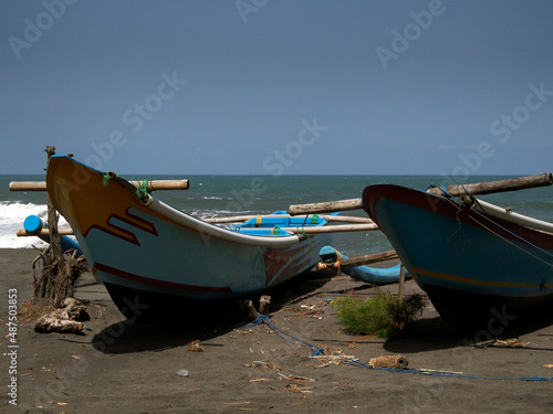 OLYMPUS DIGITALTwo fishing boats are docked on the beach of Goa Cemara  south of the city of Yogyakarta  Indonesia  one afternoon on 18 May 2017. CAMERA
