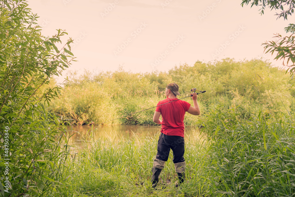 Fisherman throws a spinning view from the back. Fisherman throws a spinning view from the back.