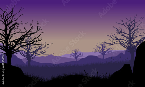 Aesthetic mountain panorama silhouette with dry trees from out of the city © City