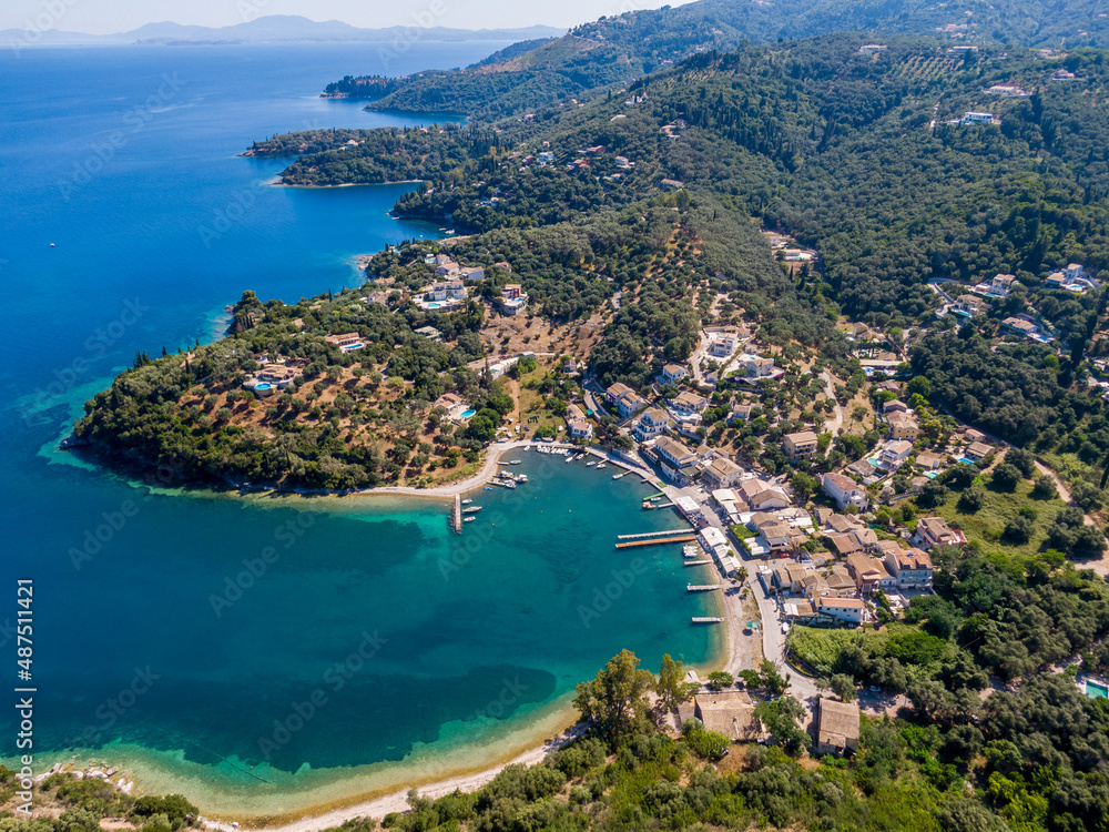 Agios Stefanos bay, the most beautiful fishing villages in Corfu Island. Kerkyra, Greece. Aerial drone view.