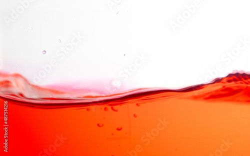 the red water splash and air bubbles on white background,Isolate picture.