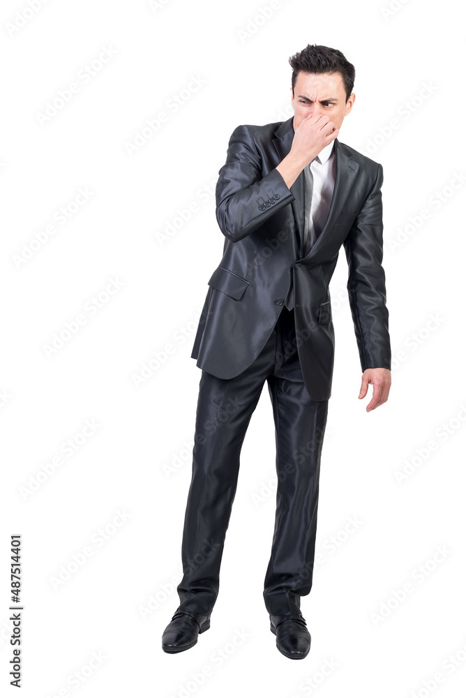 Businessman feeling bad smell in studio. White background. Businessman feeling bad smell in studio. White background.
