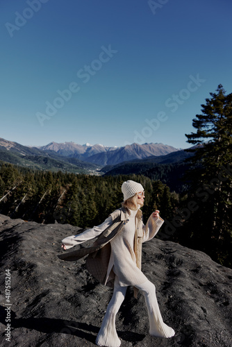 Stylish woman Cliffs mountains fashion posing nature fresh air lifestyle
