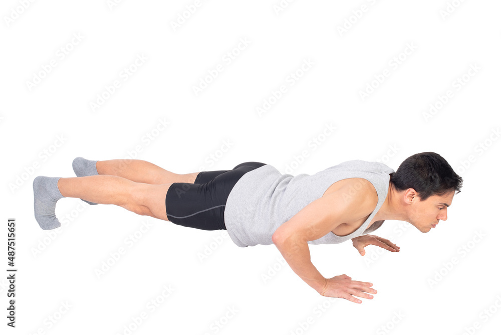 Obraz premium Serious man in activewear performing push ups